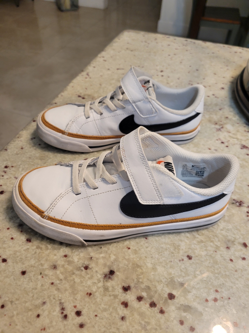 Nike Kids' White & Black Low Top Sneakers with Gold Accent